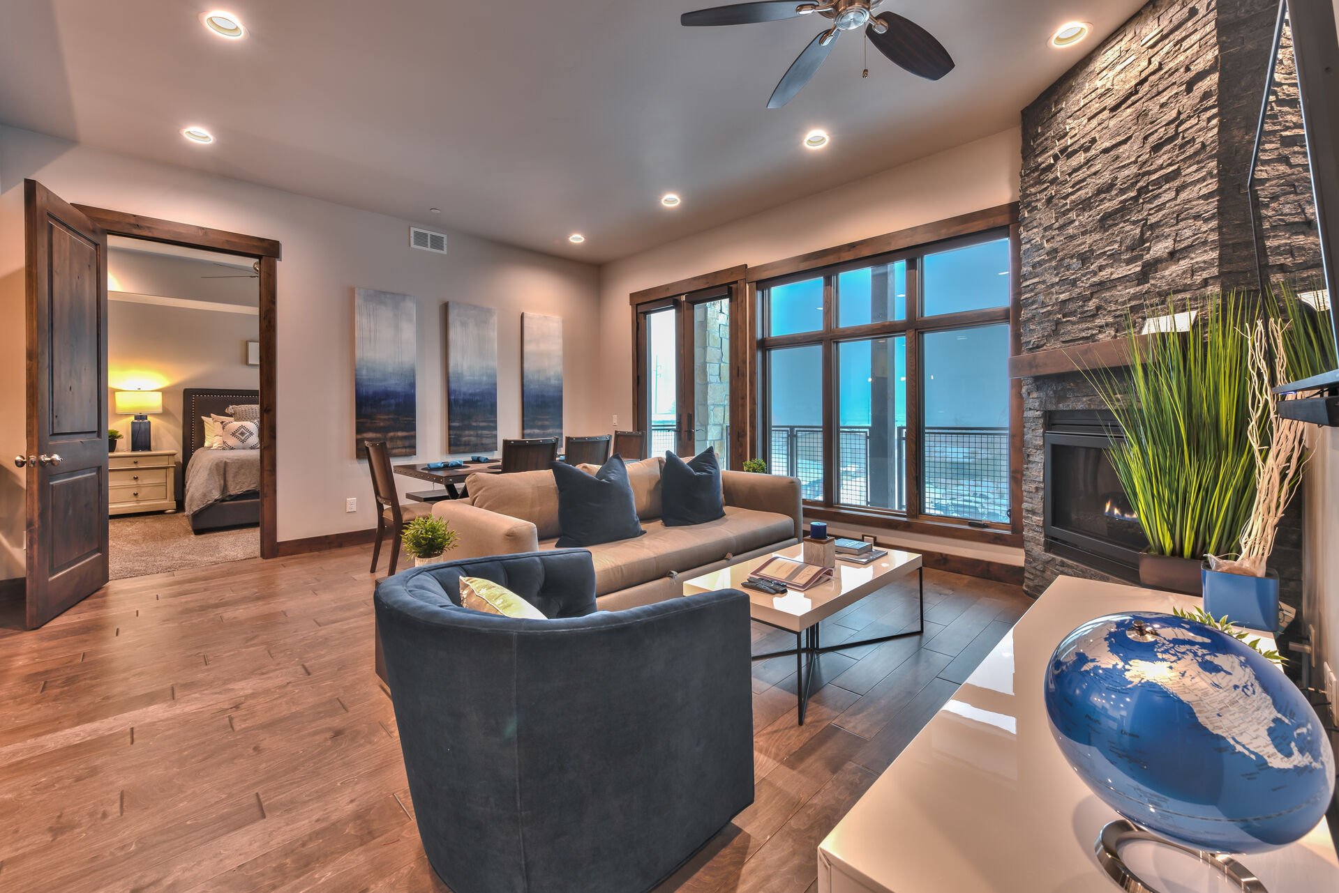 Living Room with a Queen Sleeper Sofa, Warm Gas Fireplace, Smart TV, and Hardwood Floors