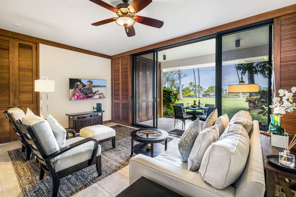 Living Area with Sofas, Armchairs, Smart TV and Access to Lanai