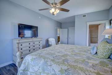 Master bedroom with king size bed and large flat screen TV