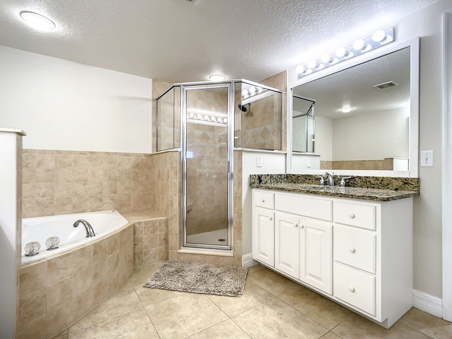 Master bath with a walk in shower.