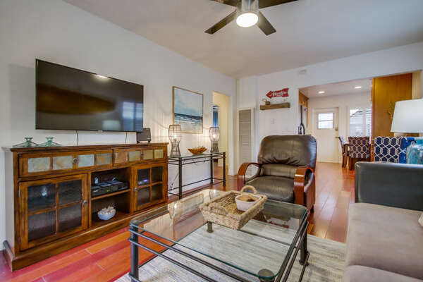 Living Area with TV, Buffet Console, Coffee Table, and Chair.