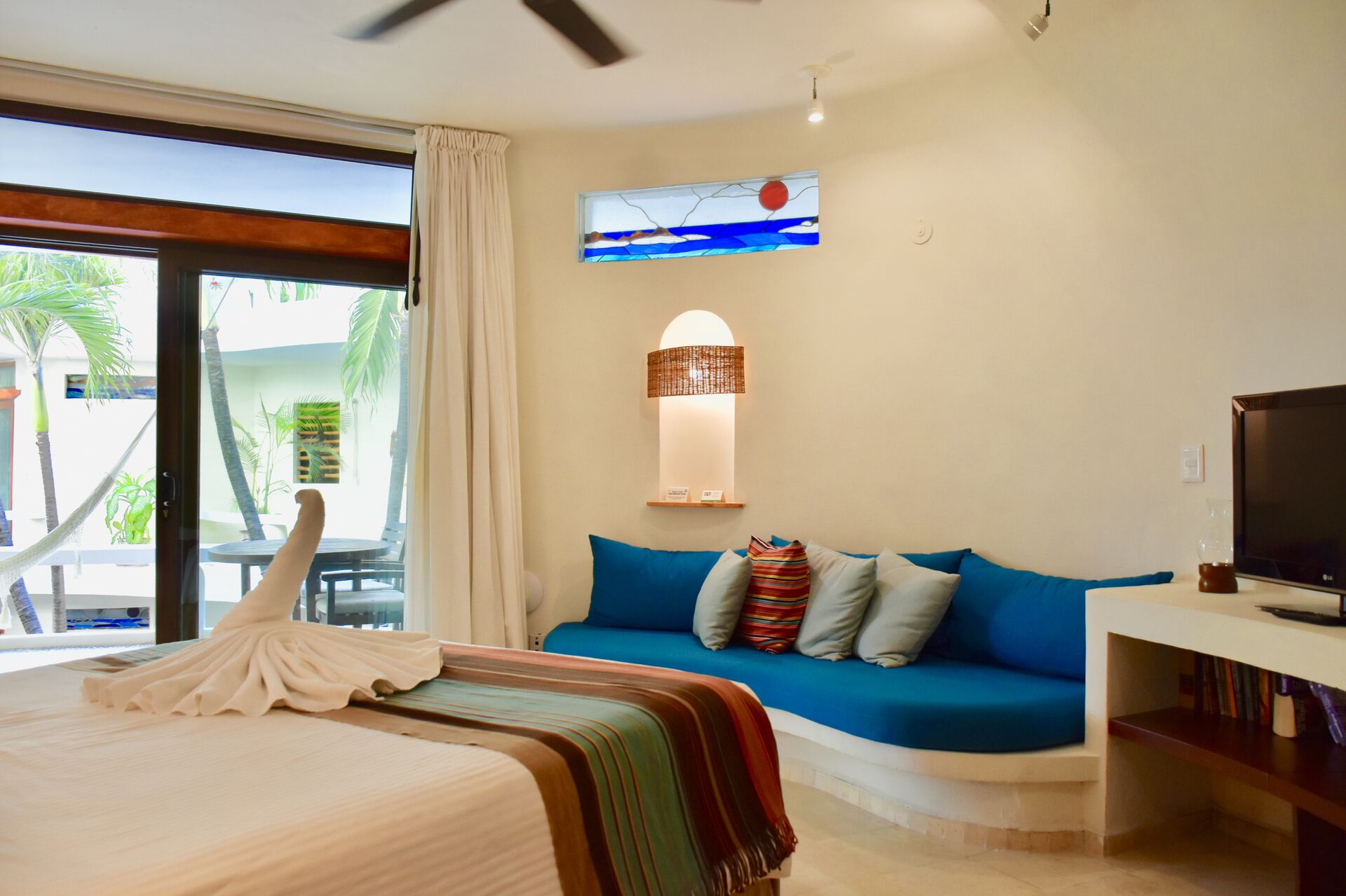 Fully furnished ocean view suite with queen size bed and kitchenette.