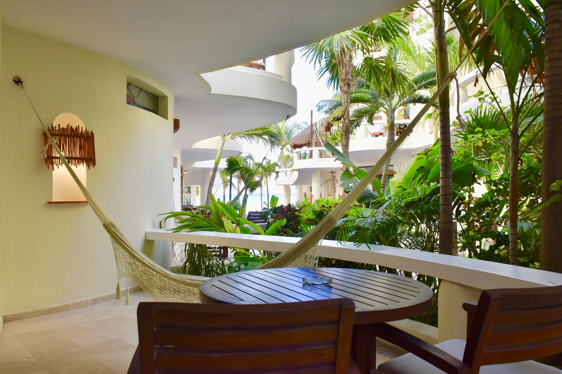 Amazing view balcony with chairs and hammock.