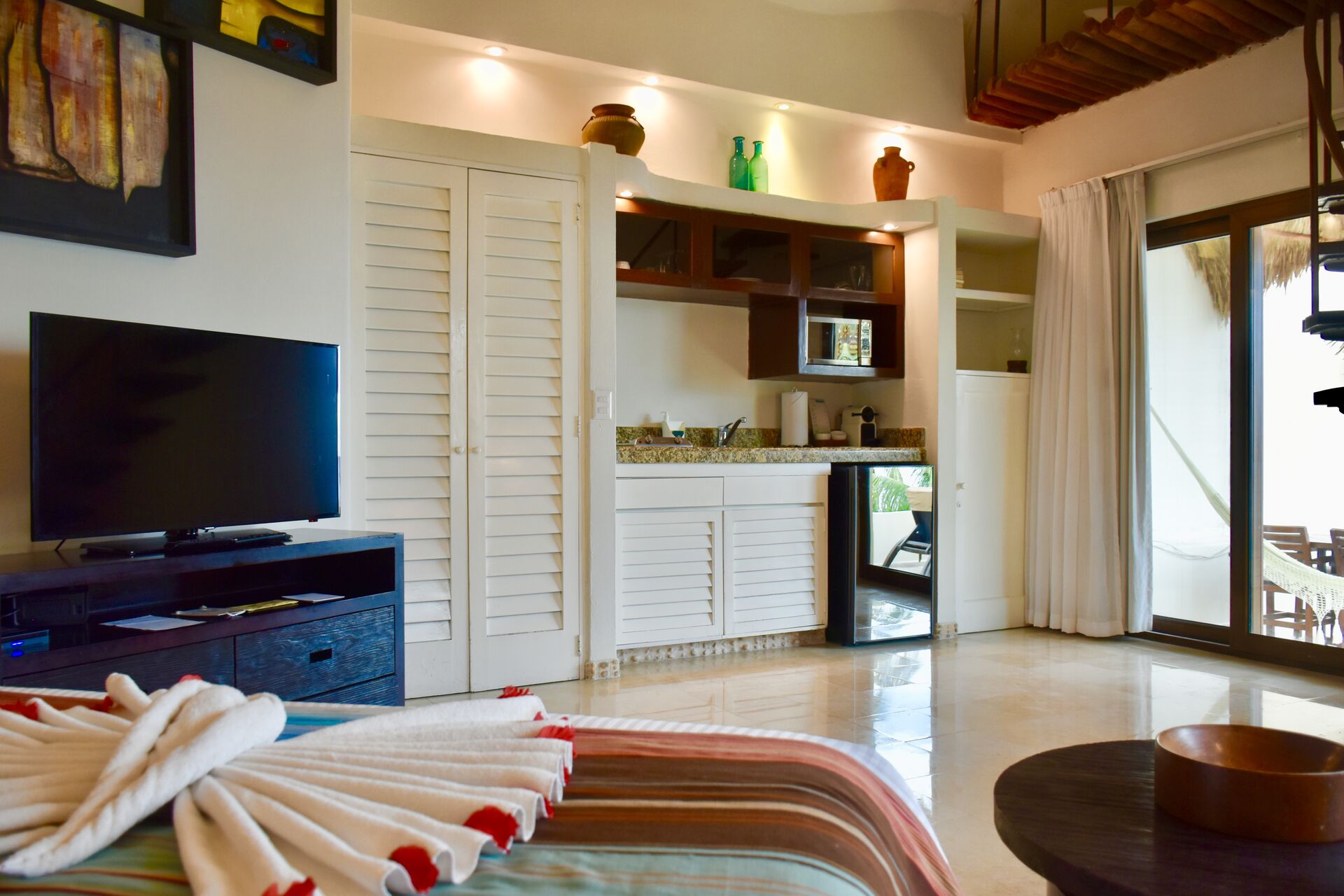 Fully furnished ocean front suite with queen size bed and kitchenette.