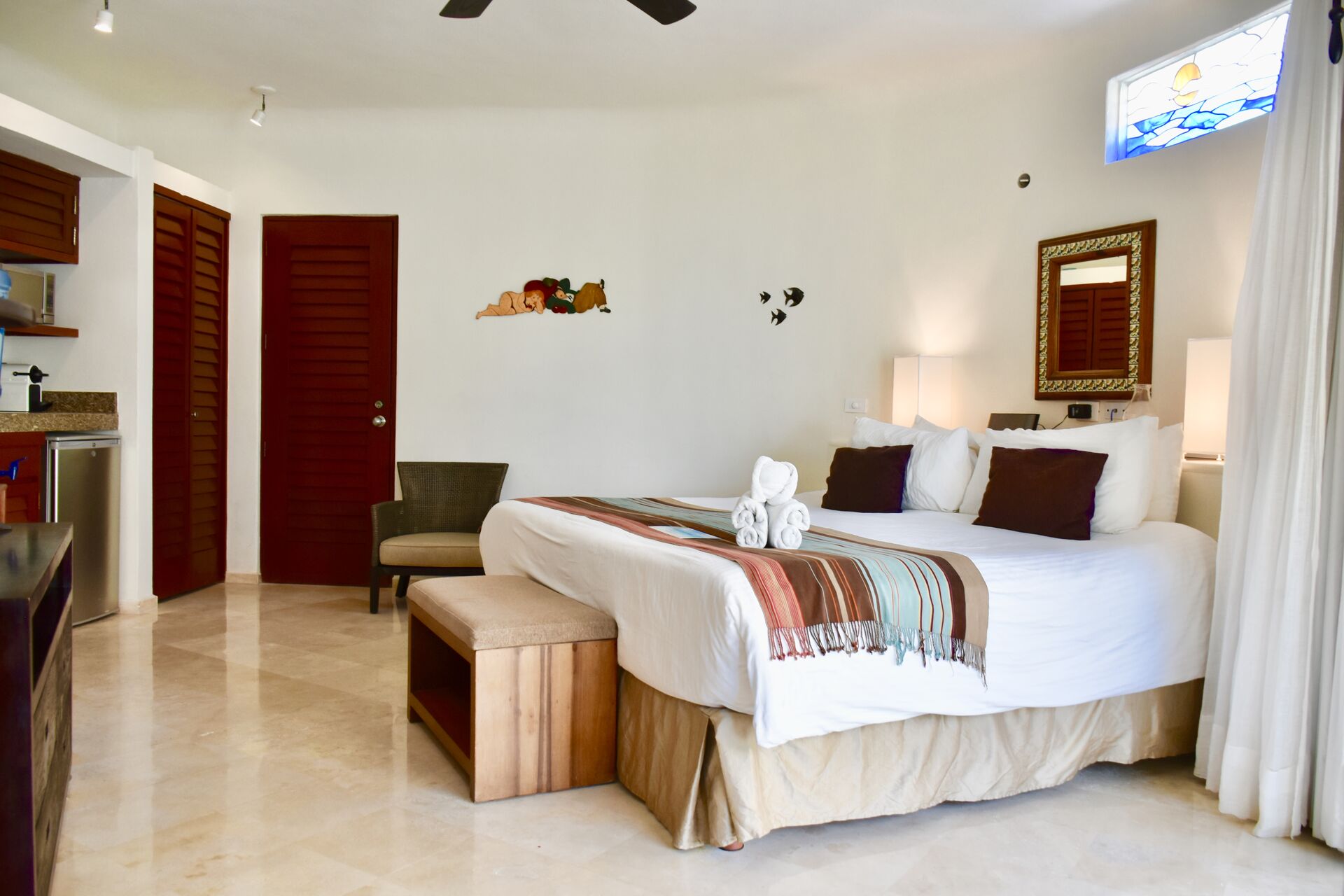 Amazing ocean view suite with king size bed and kitchenette.