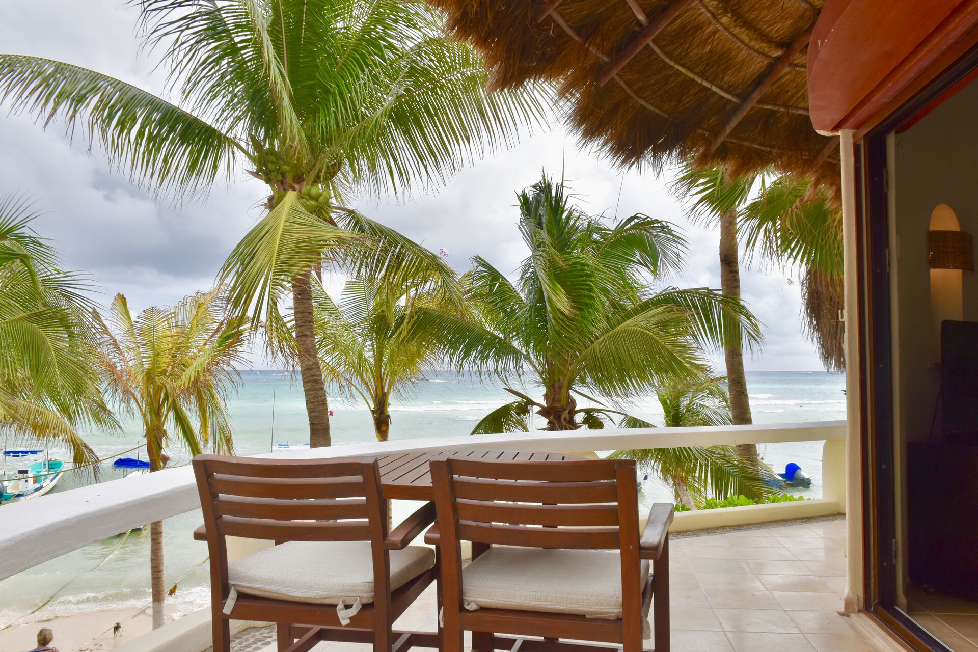 Ocean front suite, incredible ocean view balcony with chairs and hammock.
