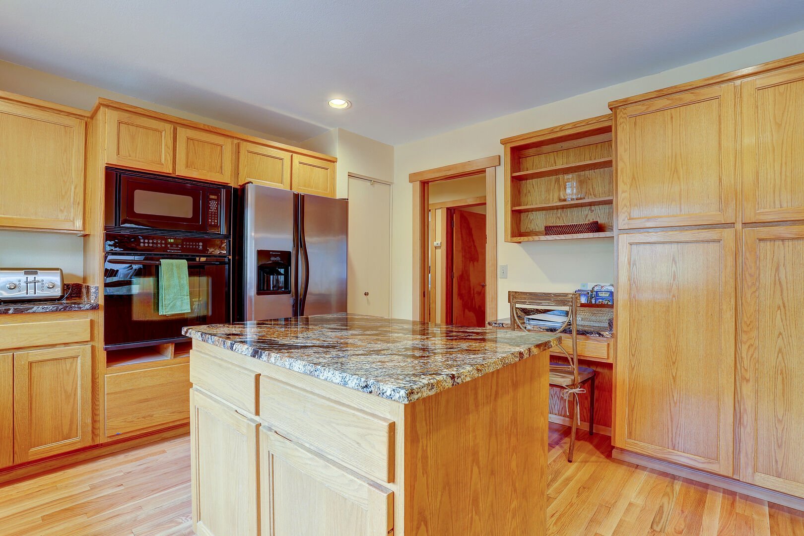Granite topped central island in the kitchen.