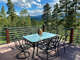 There is outdoor furniture on the deck to enjoy a meal or relax with a bottle of wine.