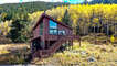 The home sits amongst some aspen trees and has great views in almost every direction