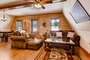 The cabin is decorated in luxurious mountain decor and finished with beautiful custom wood work.