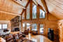 This is a true log home with exposed logs, vaulted ceilings, and two-story views.