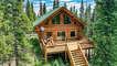 Fantastic log home surrounded by plenty of trees with great views!