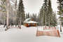 The cabin sits on a large private acreage and in the winter it is a winter wonderland.