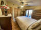 The Back bedroom features walkout access to the elevated deck