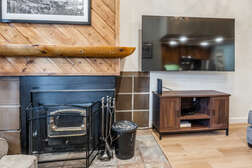 Living Room, 80 inch Flatscreen TV, Wood Burning Fireplace