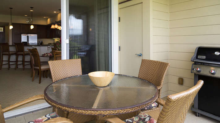Lanai of this Kona Hawaii vacation rental with table and grill.