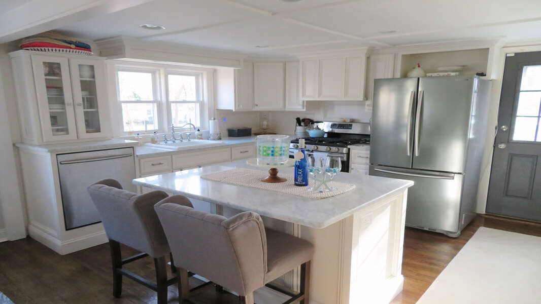 Open kitchen with stainless steel appliances and granite countertops - 10 Seventh Street Harwich Cape Cod - New England Vacation Rentals