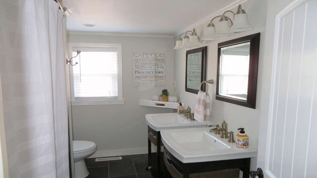 Full bath off of hallway with shower, tub and double sinks - 10 Seventh Street Harwich Cape Cod - New England Vacation Rentals