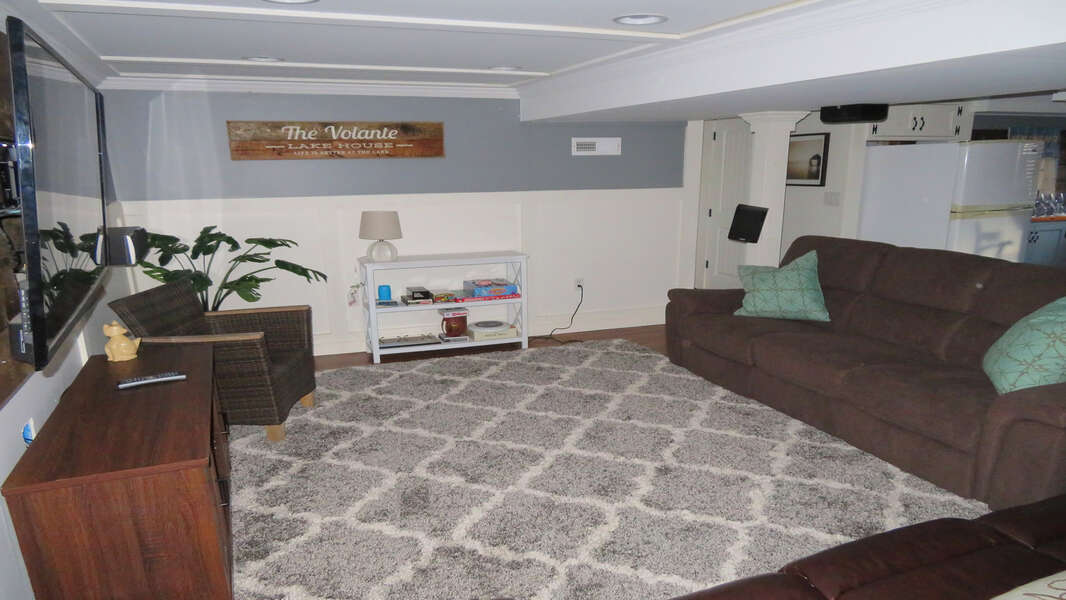 Lower level entertainment area with room for blow up mattresses (provided) for 