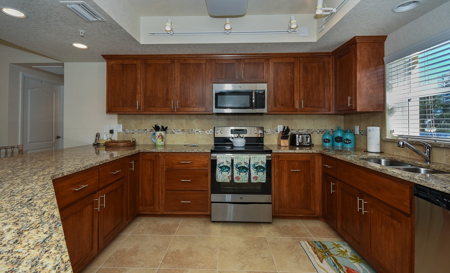 fully equipped kitchen with an oven and a microwave