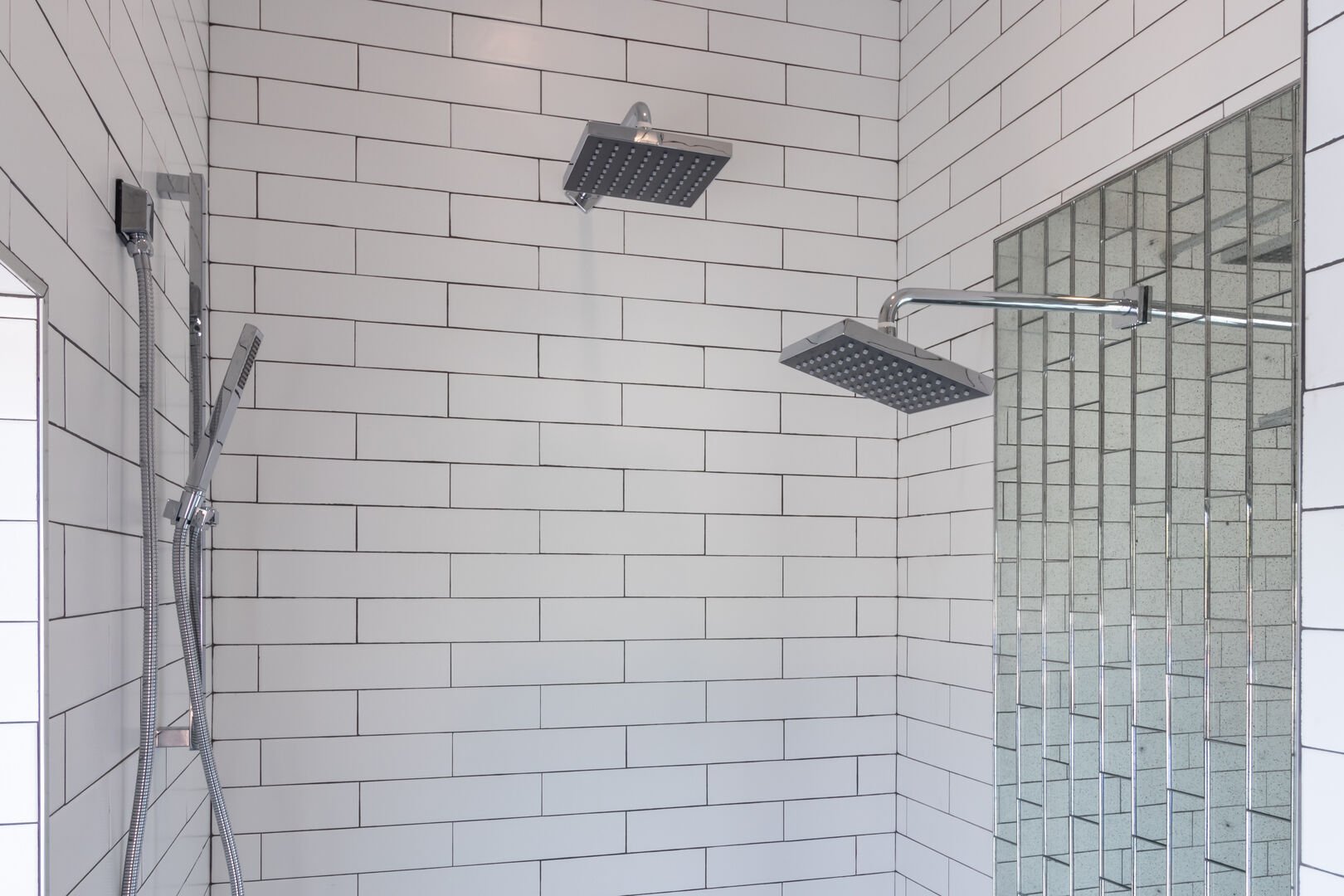 Bathroom Shower Features Three Shower Heads.
