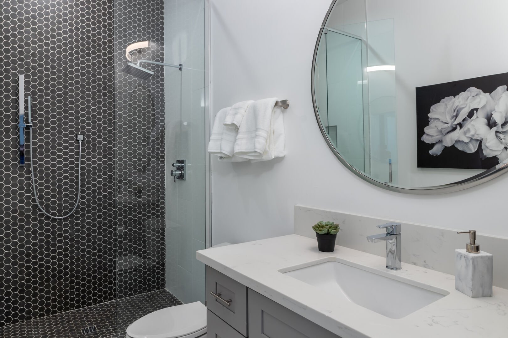 Modern Bathroom Featuring Sink, Mirror, and Shower.