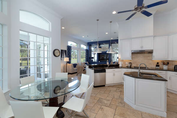 Fully equipped kitchen featuring stainless steel appliances and granite counters