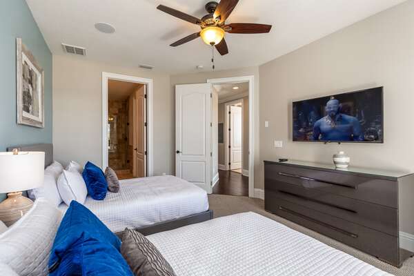 Relax after a long day at the theme parks while watching TV in this comfortable bedroom