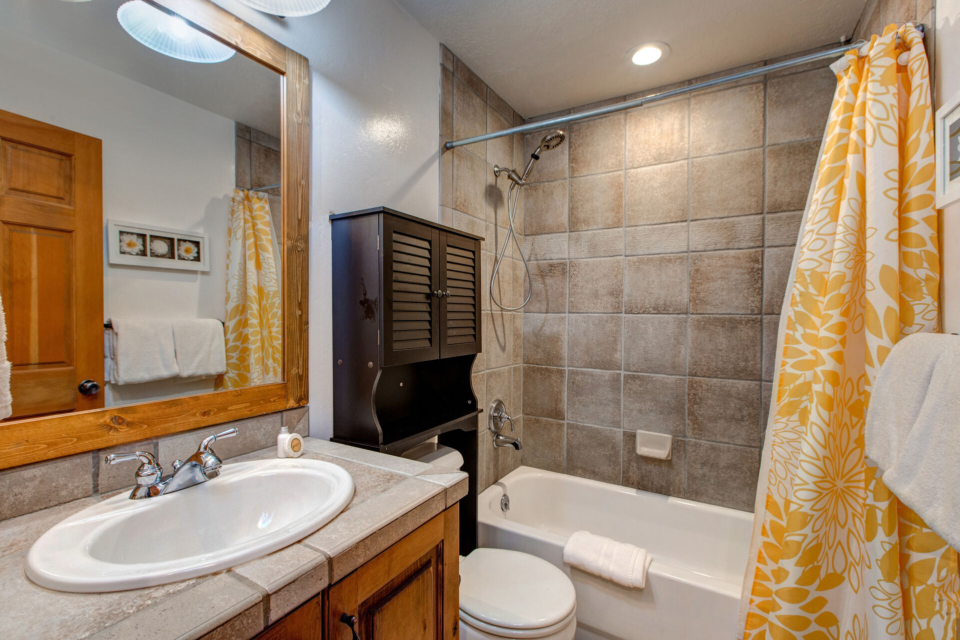 Soaking Tub and Tile Shower in Shared Bath