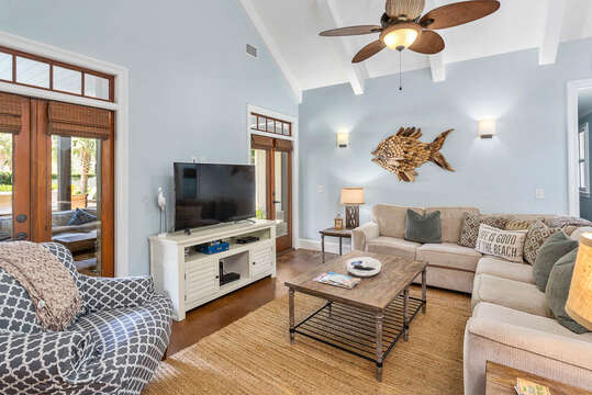 Living Room has plenty of seating and quick access to the pool!