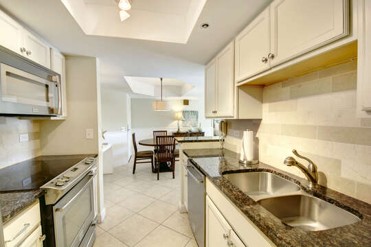 Galley Kitchen with stainless steel appliances