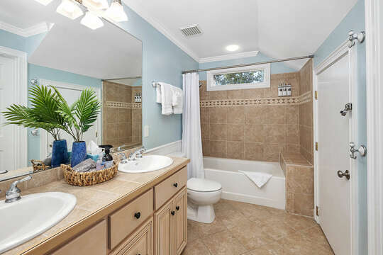 Guest Bathroom with double vanity and tub/shower combo