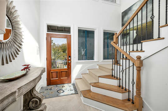A dramatic staircase leads you from the Foyer to the main Living Area.