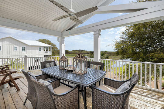 The upstairs covered Porch has seating for six and is a great place to catch the sunrise.