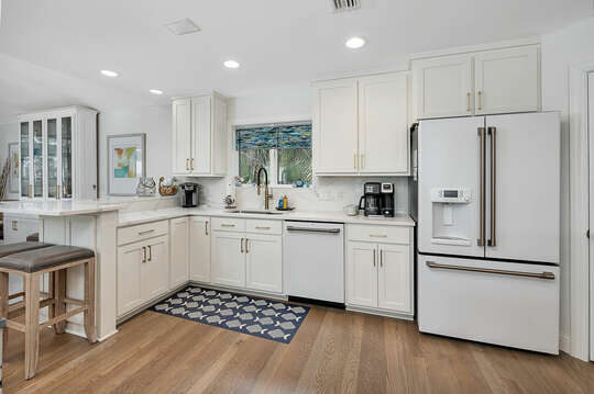Open and welcoming Kitchen features top-of-the-line appliances.