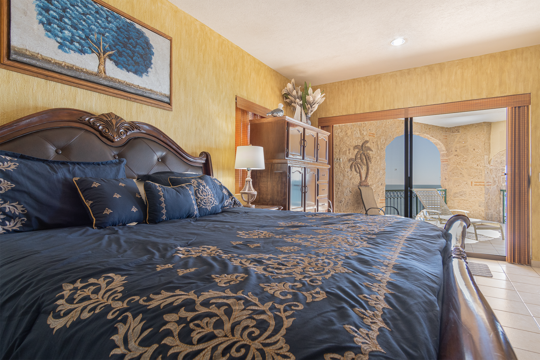 The main bedroom is beachside, with sliding door access to the patio.