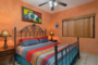 The first bedroom is colorful and traditional.