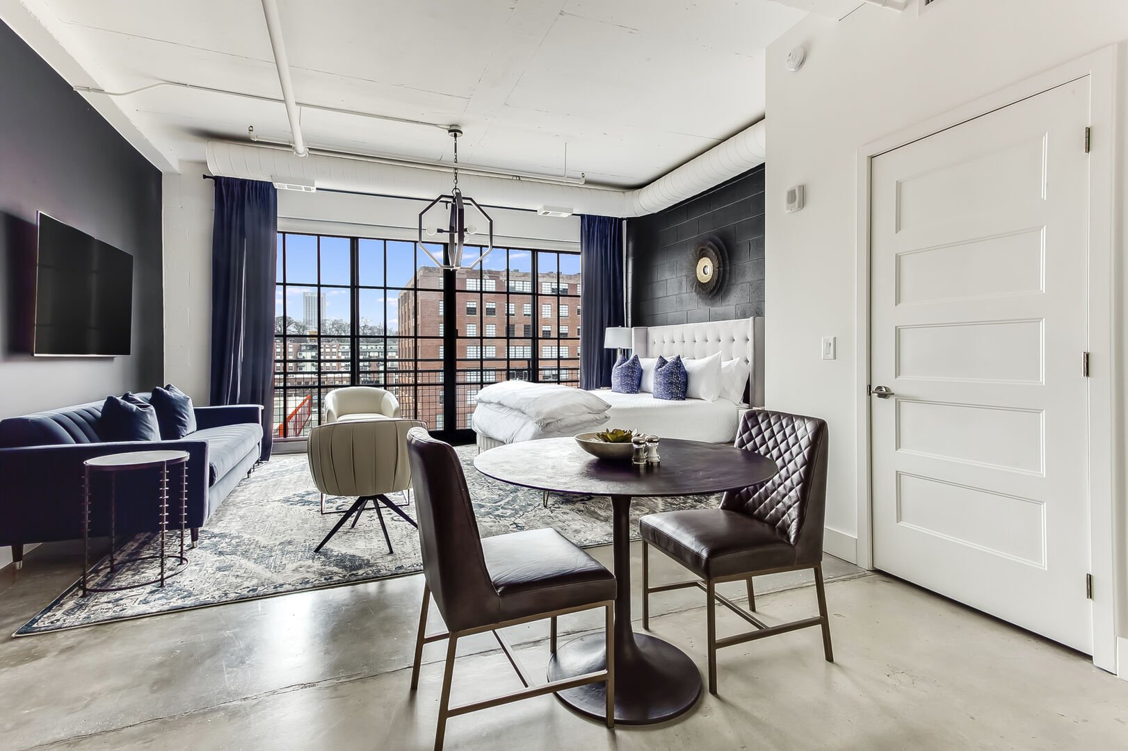 Dining Area for Two and Concrete Floors at Ponce City Market Apartment