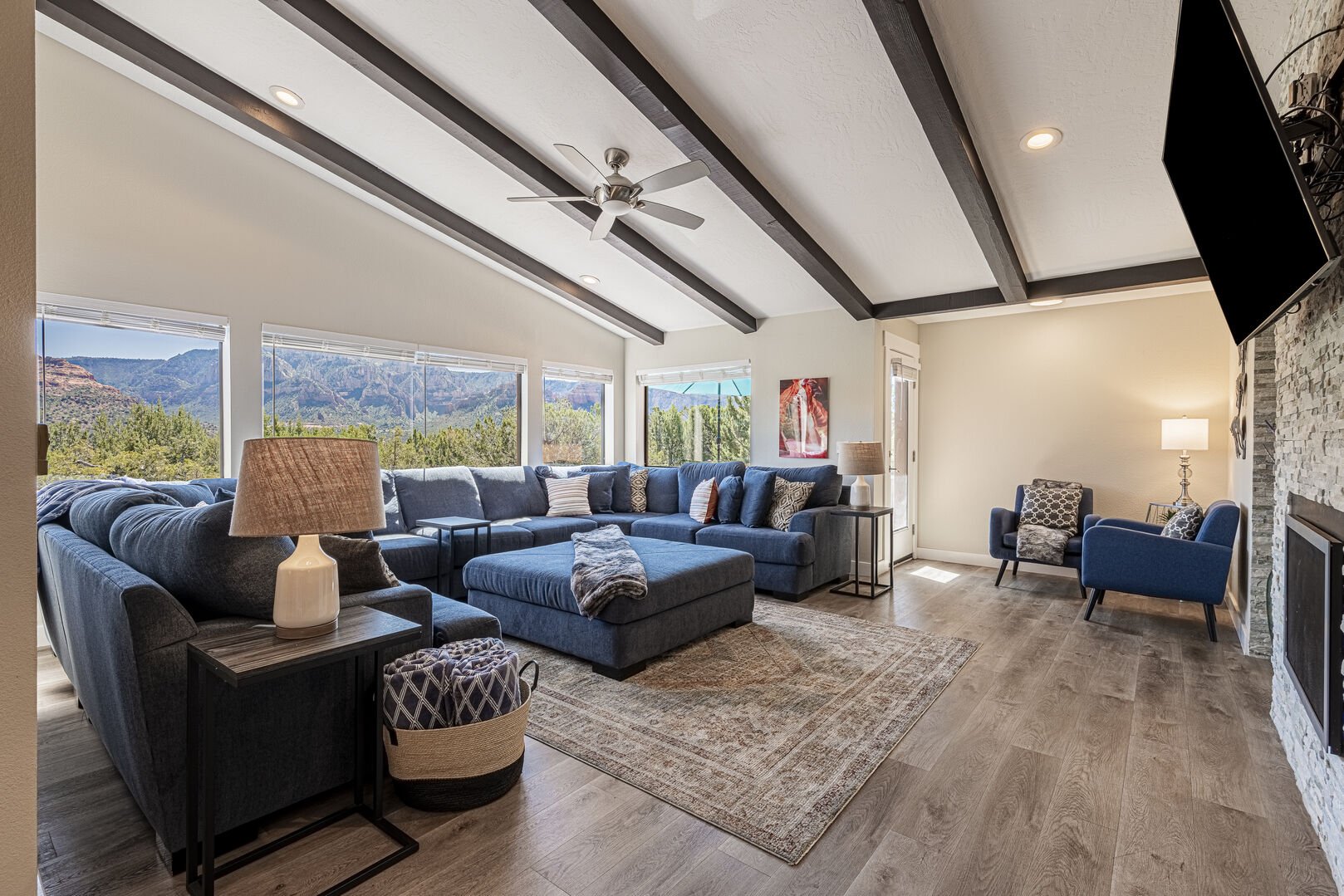 Spacious Living Room with a Large Sectional Sofa and Big Picture Windows to Enjoy the Amazing Sedona Red Rock Views