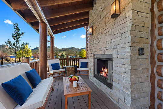Outdoor patio with fireplace and hot tub