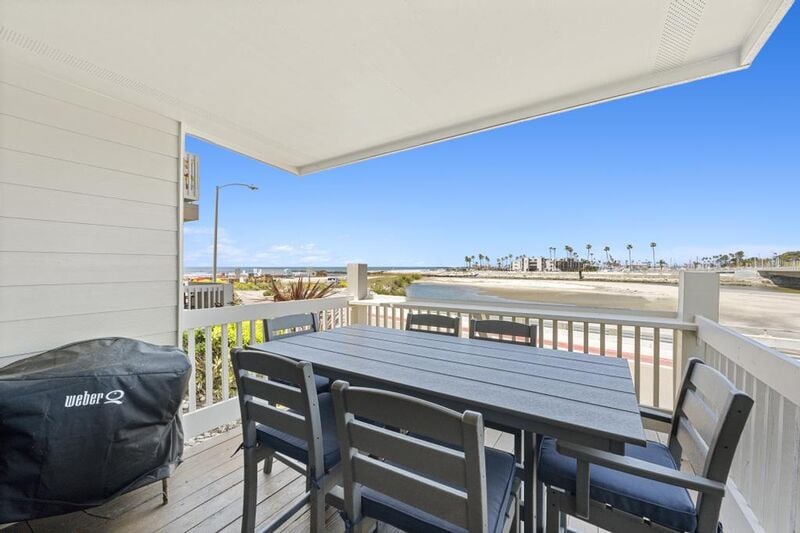 Enjoy the large balcony table with seating for 6 guest with amazing ocean views