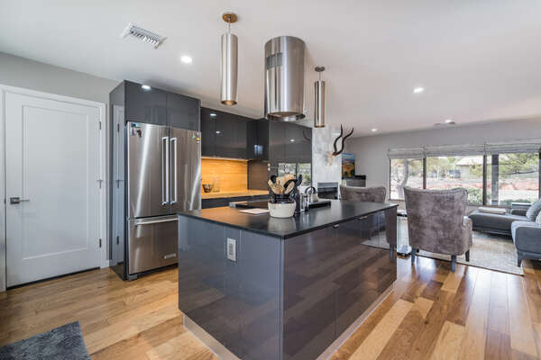 Fully Equipped Kitchen with Stainless Steel Appliances Including an Electric Range