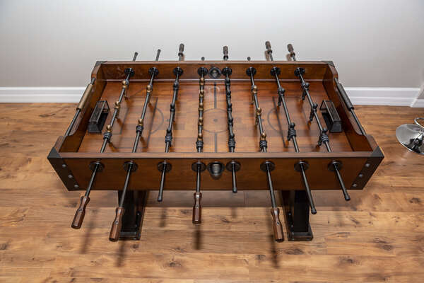 A fashionable foosball table that matches the media room decor perfectly