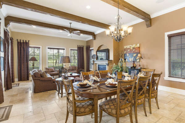 This dining table is conveniently located in the open living space and features room for 8 guests to sit