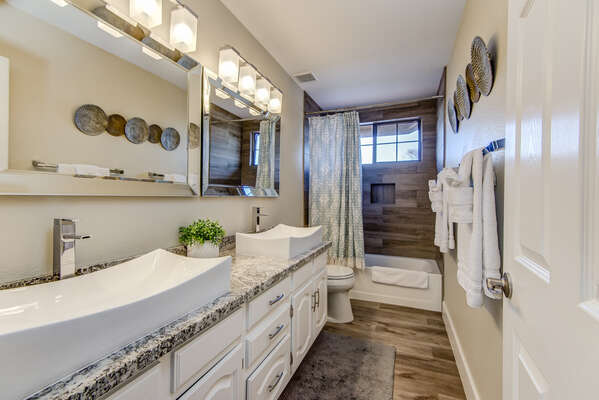 Upper Level Full Shared Bathroom 2 with Dual Sinks and a Combo Tub/Shower