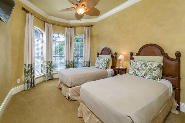 This bedroom with two twin beds is located on the first floor