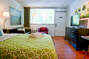 Fresh Linens and Furnished Living Space - Corporate Apartments - Studios On 25th  S01