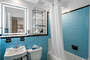 Blue Shower Tile Bathroom - Furnished Apartments in Atlanta - Cool Classic Studios On 25th