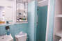 1950s Mid-Century Sky Blue Shower Tile Bathroom - Furnished Apartments in Atlanta - Cool Classic Studios On 25th S01