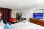 Furnished Living Room and Bedroom - Corporate Apartments - Chic Premium Studios On 25th